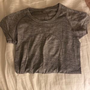 size 2 lulu grey swiftly shirt! worn lightly and in good condition!